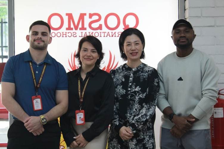 Qosmo staff members standing together.